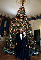 Clintons Stand in Front of White House Christmas Tree in the Blue Room