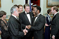 President Reagan Speaks with Brazilian President and Pelé at State Dinner