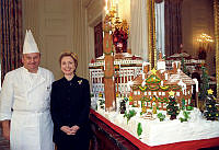 Mrs. Clinton and Chef Mesnier Pose with the 1999 White House Gingerbread House